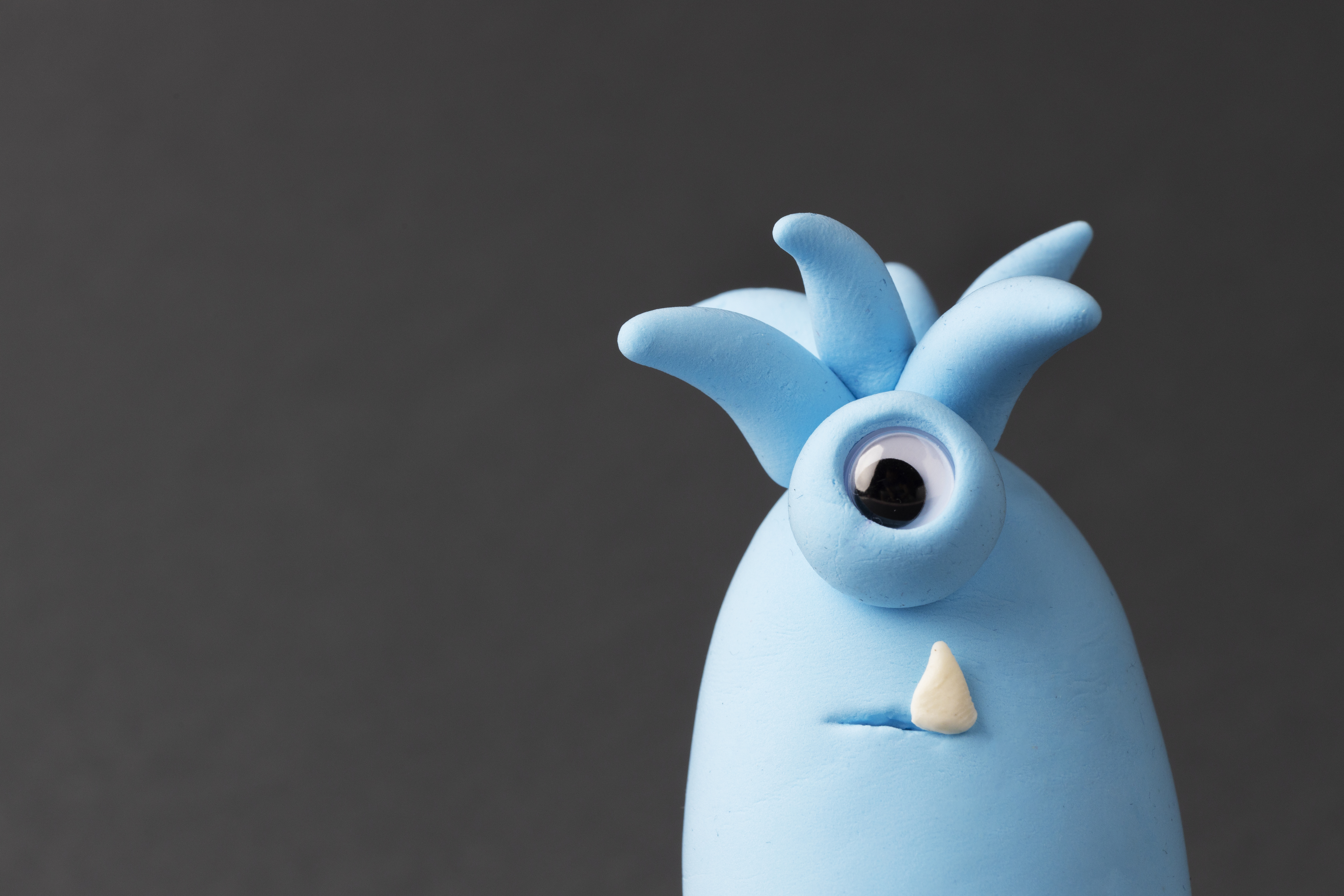 Photo of a cute alien with one eye made from blue modelling clay