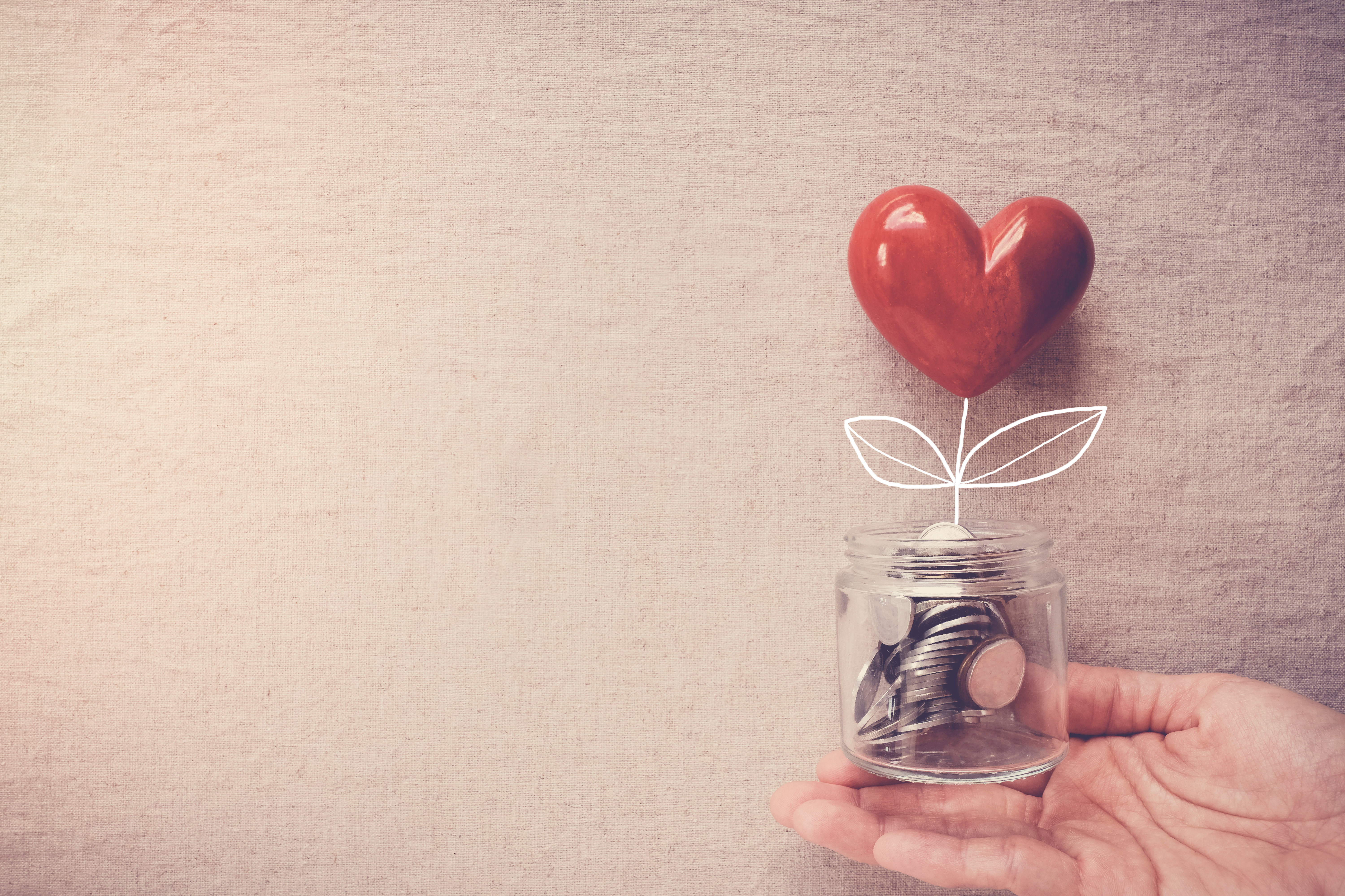 Hand Holding Jar Heart Tree Growing Money Coins