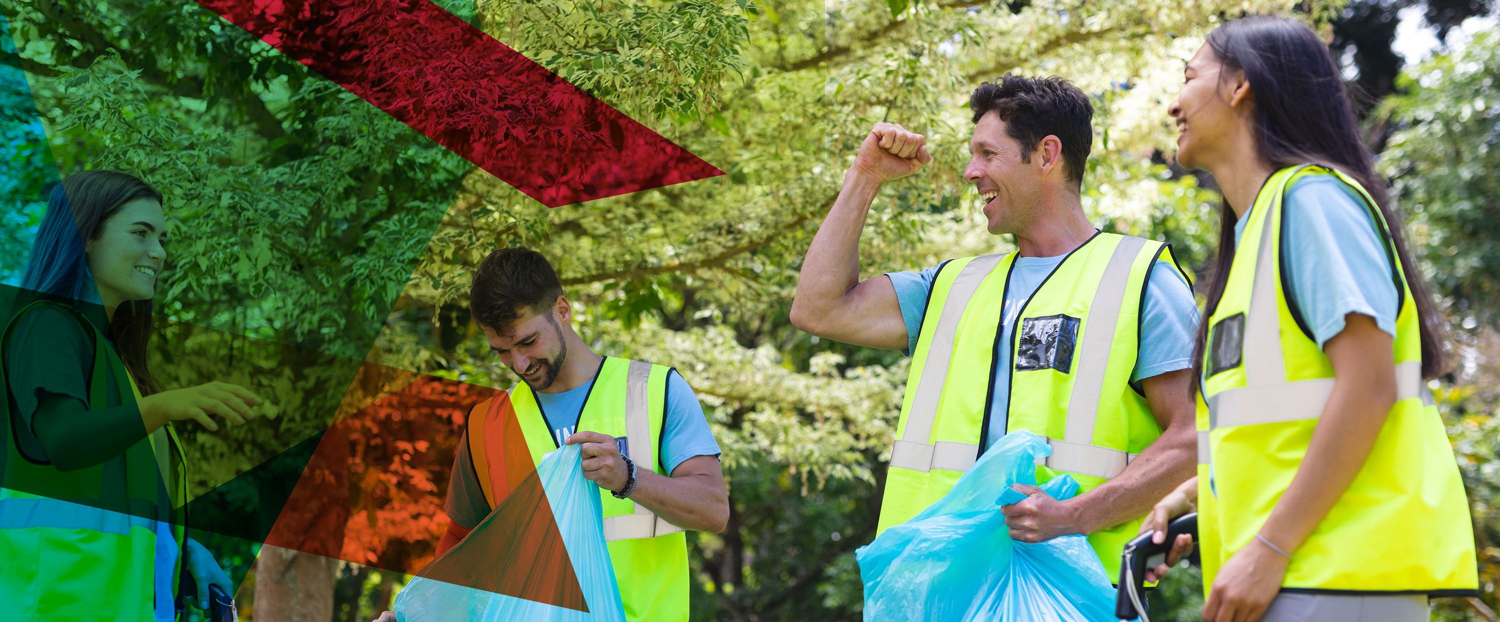 Photograph of three people in woodlands wearing hi visibility jackets