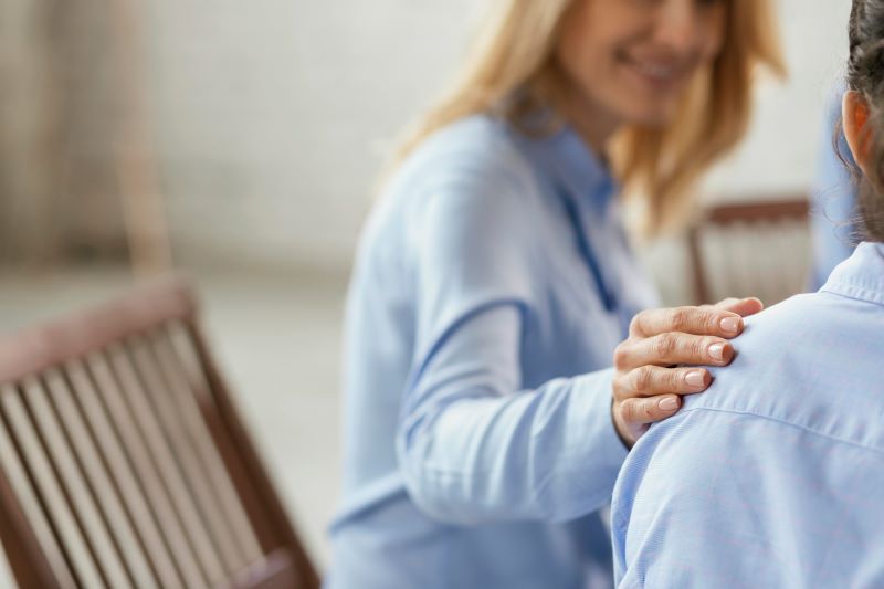 Person With Hand On Someones Shoulder