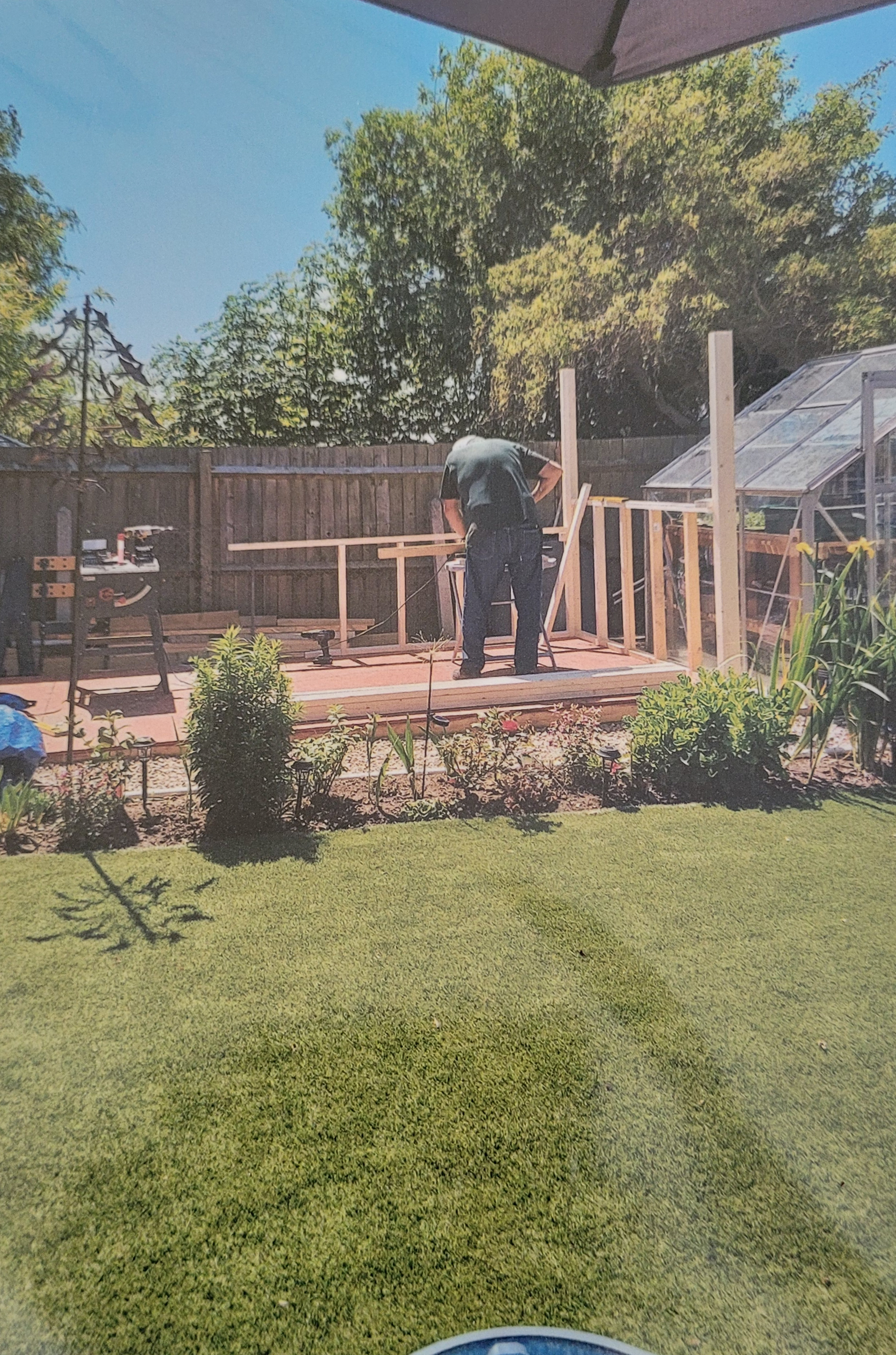 Photo of a customer building a garden shed