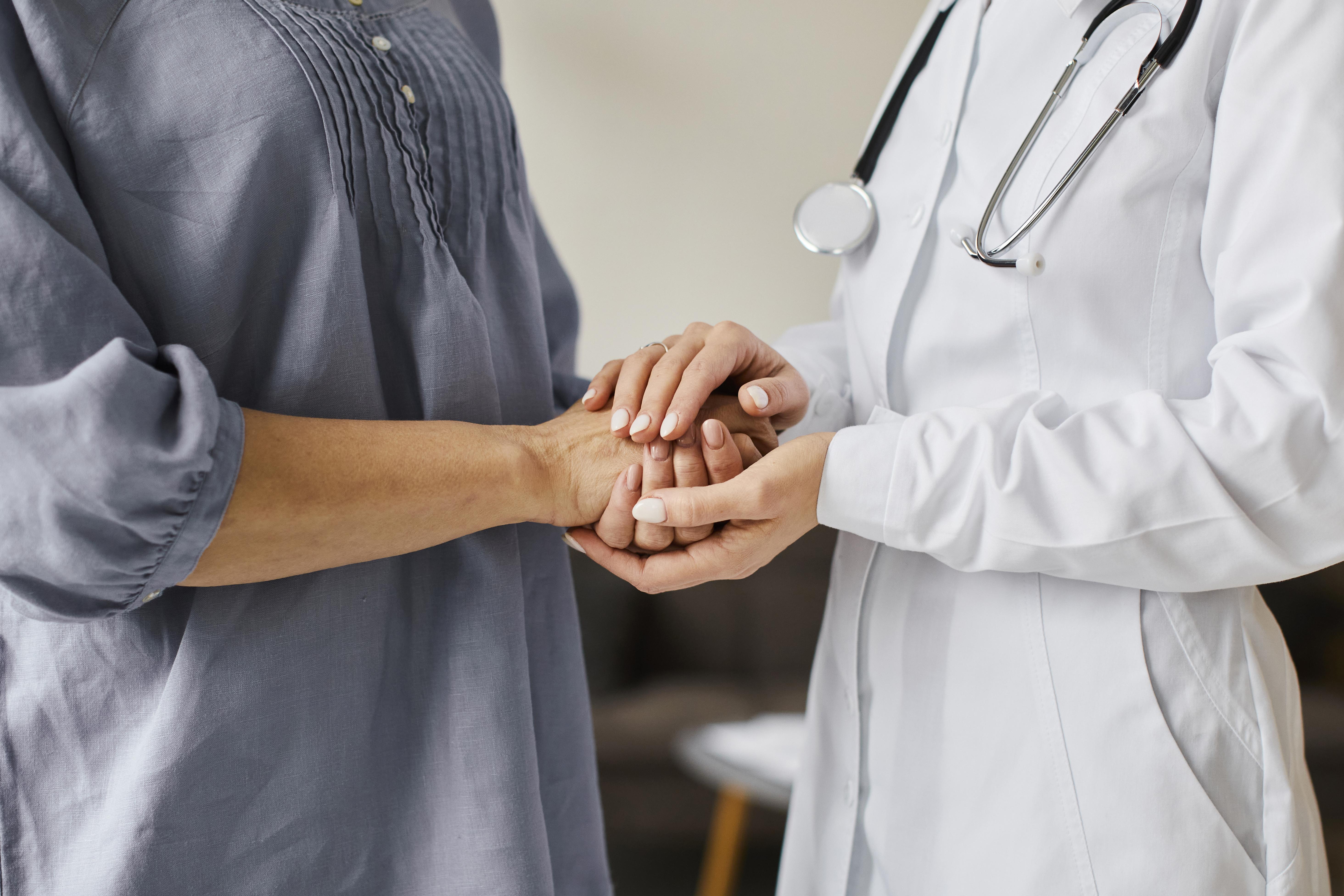 Covid Recovery Center Female Doctor Holding Older Patient S Hands