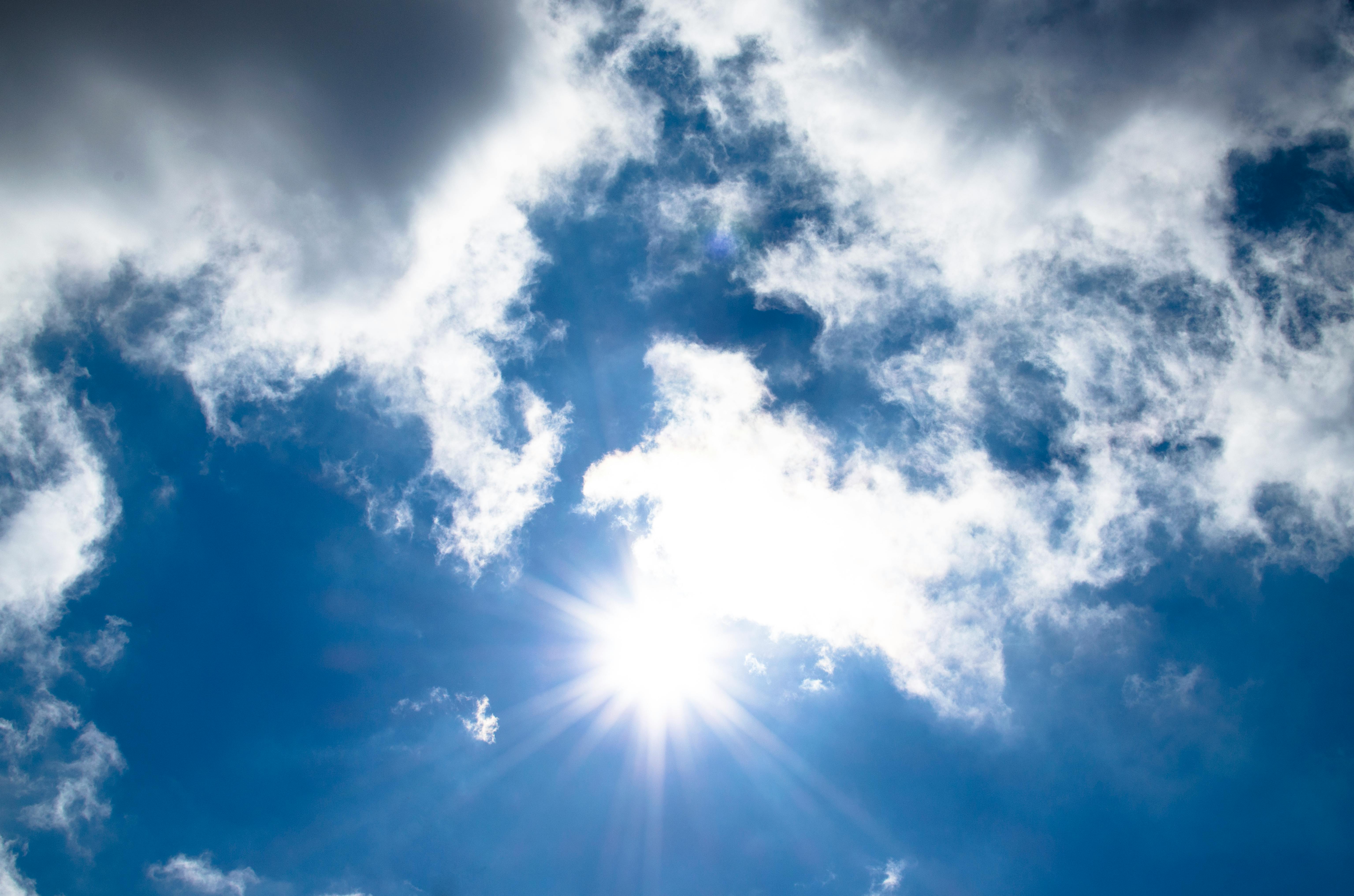 A bright blue sky with light cloud coverage