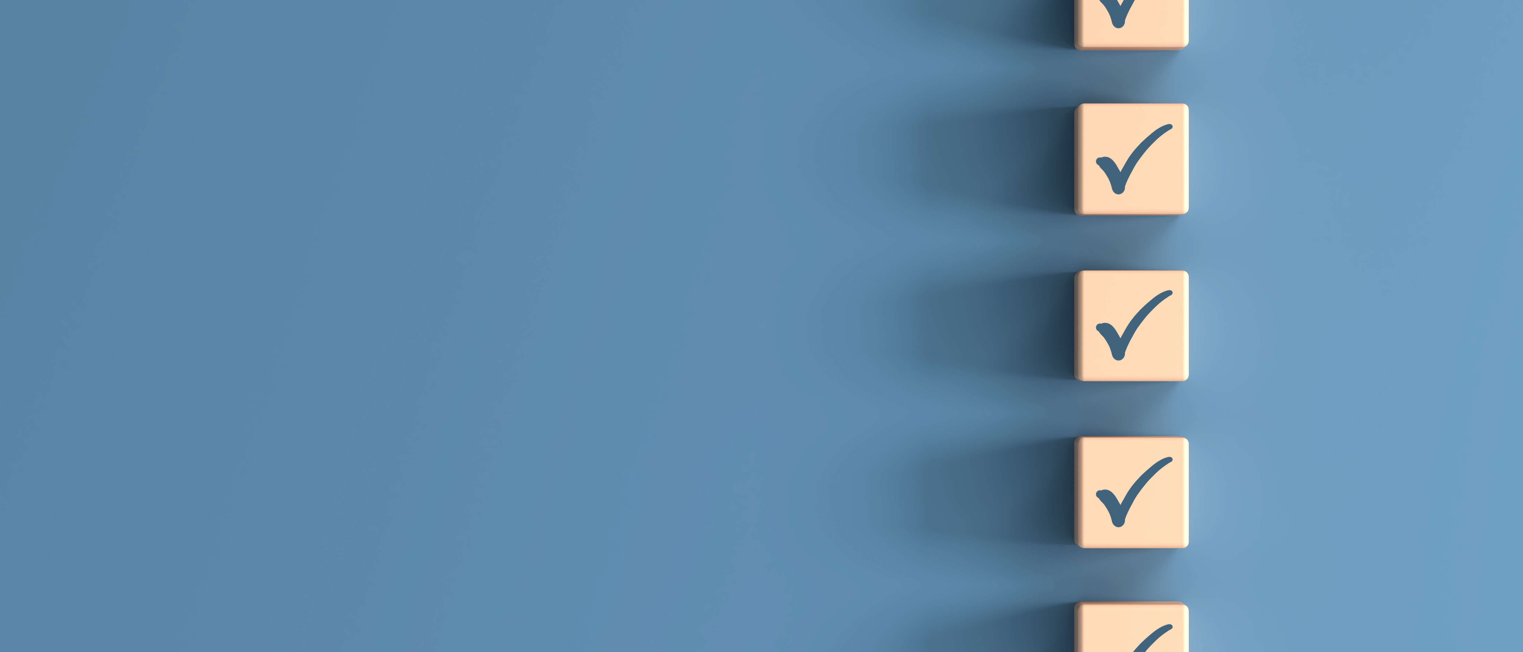 Printed ticks on several small wooden blocks arranged neatly in a vertical line.