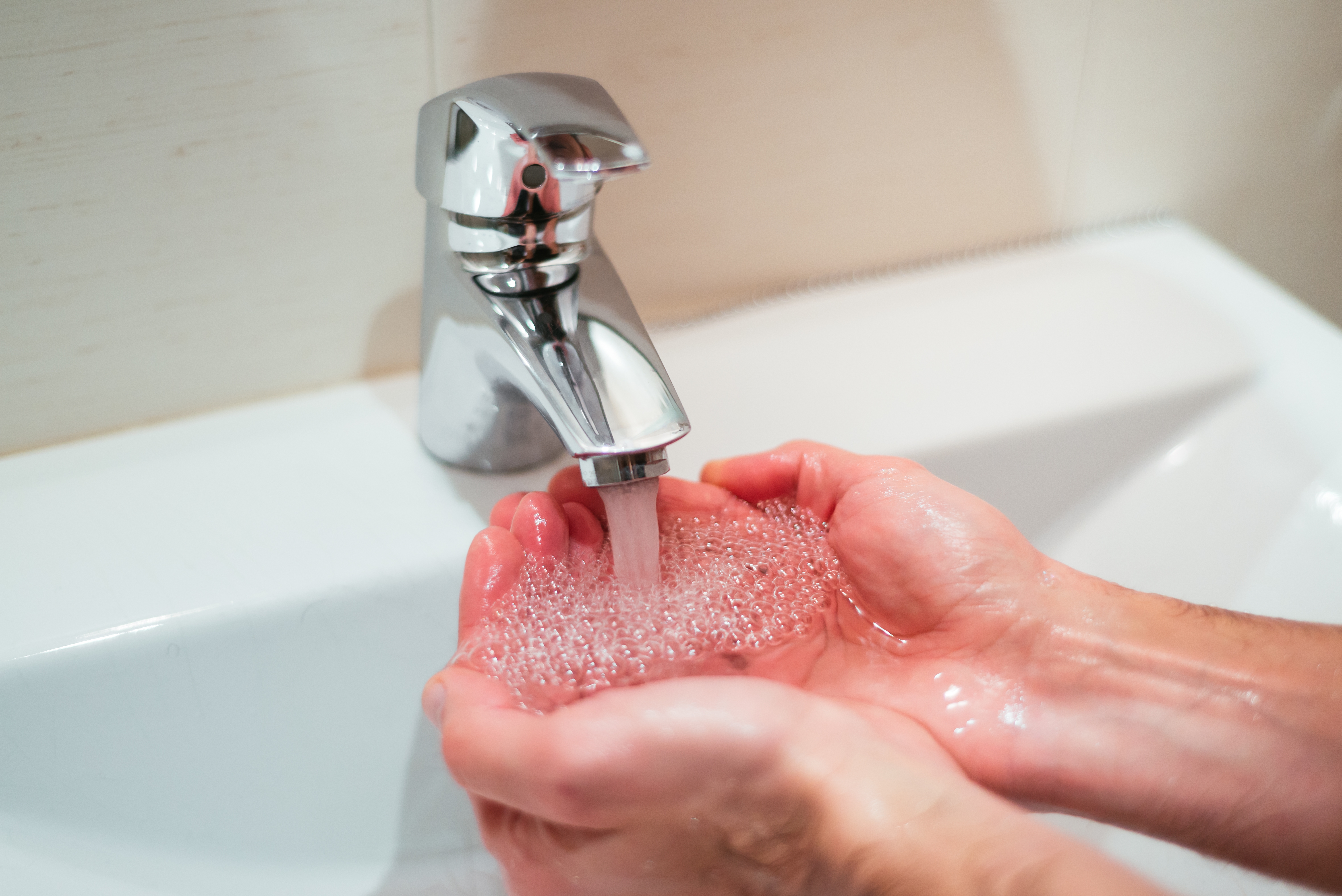 Closeup Shot Person Washing Hands Sink