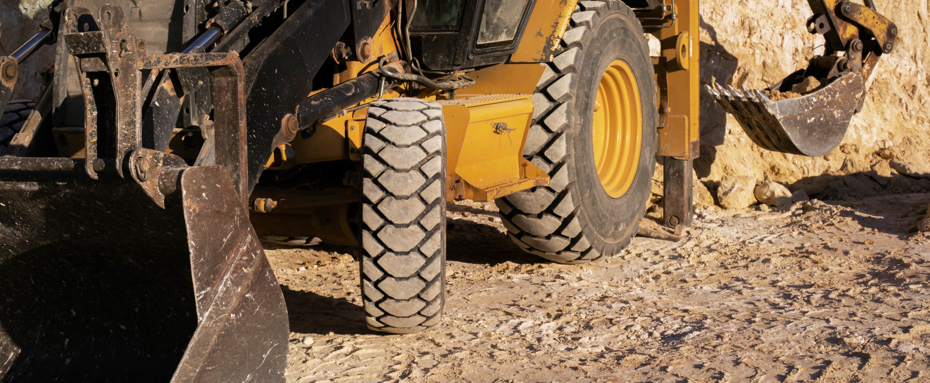 Excavator digging ground