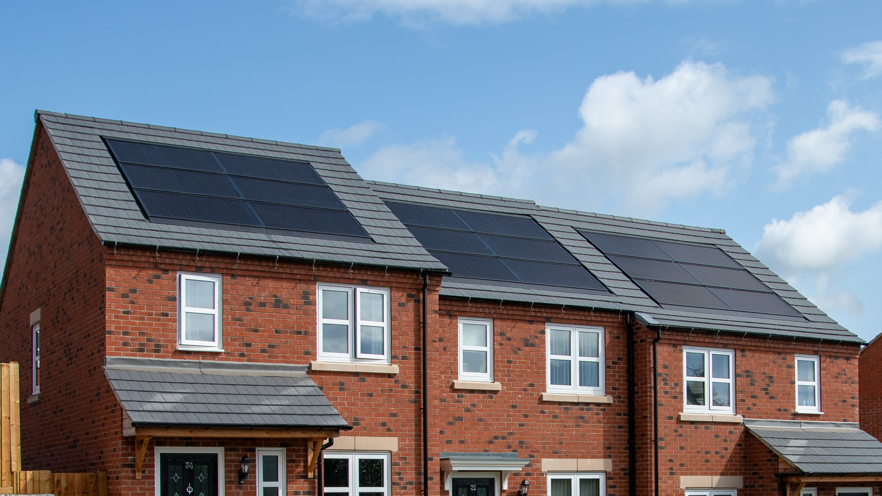 Close-up of solar panels on roofs of houses
