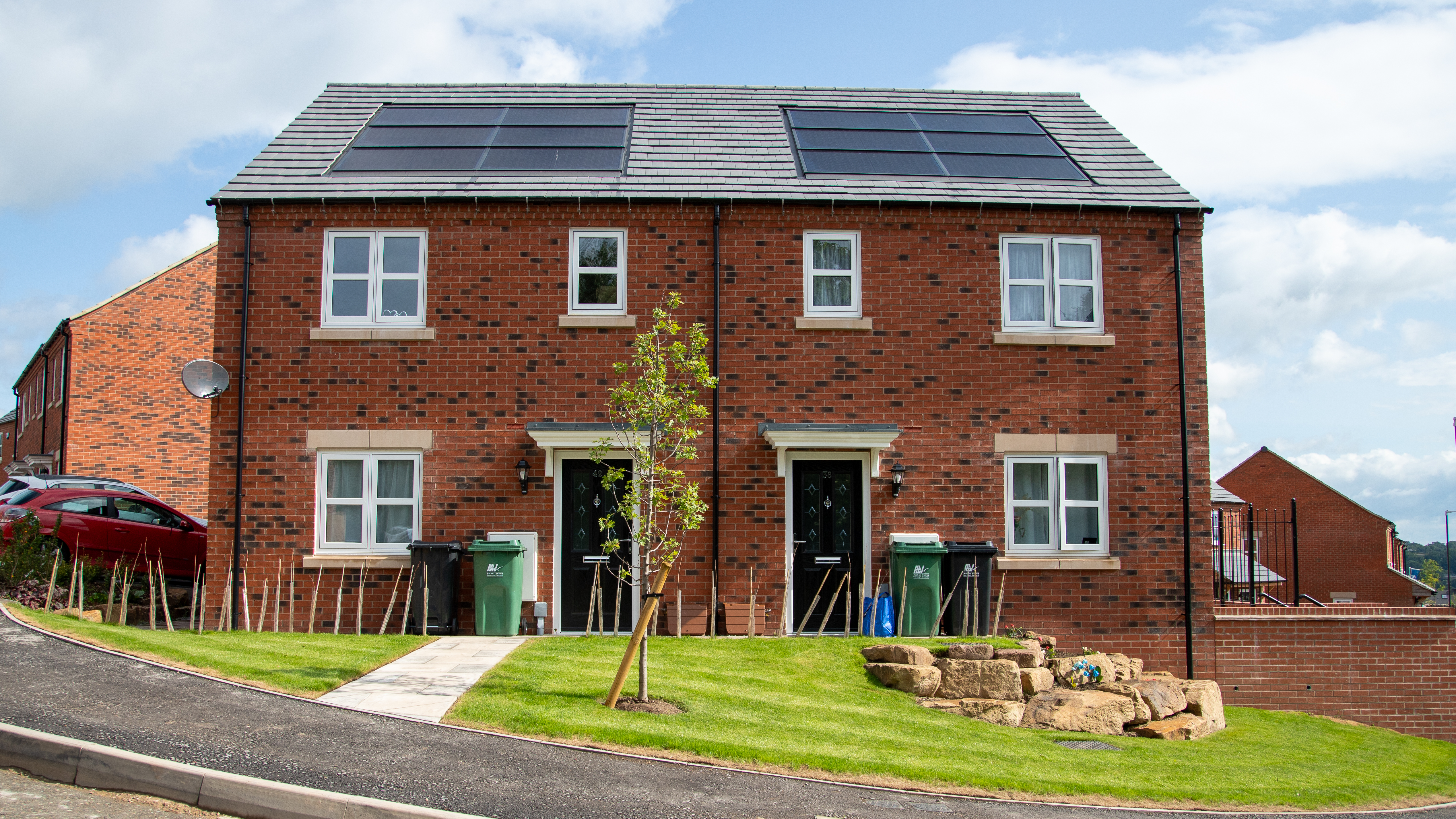 Two semi detached houses with solar panels on